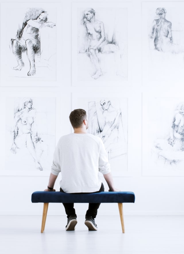 man-relaxing-in-art-gallery-P9C4CGY-min